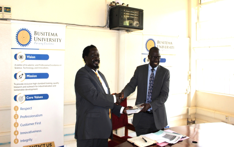 Assoc. Professor Kucel hands over office